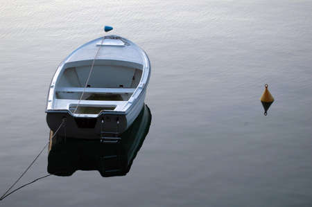 Alone boat in the port at end of dayの写真素材