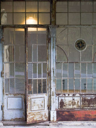 Old metallic rusted door is little openの写真素材