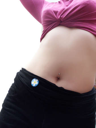 Girls with piercing stomach on isolated backgroundの写真素材