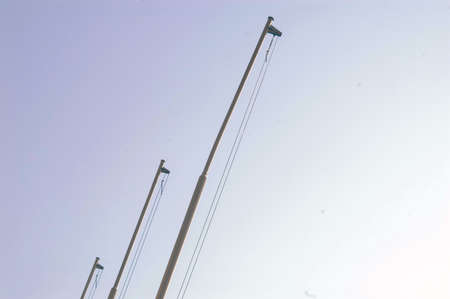 Urban street detail - three flags pillar and skyの写真素材