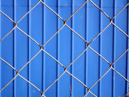 Blue metallic wall and grey metallic wireの写真素材