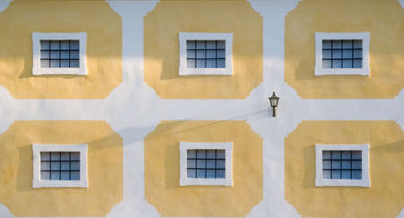 Wall with many windows and one nice lantern