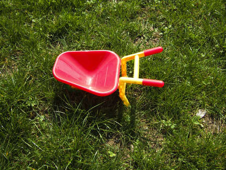 Lonely toy in the fresh green grass parkの写真素材