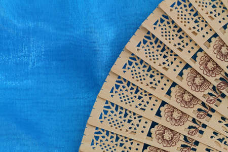 Chinese wooden fan on blue patternの写真素材