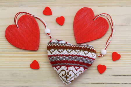 Wooden and knitted hearts の写真素材