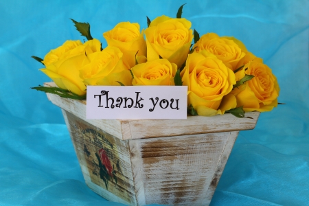 Thank you note with yellow roses in vintage wooden flower box on blue backgroundの写真素材