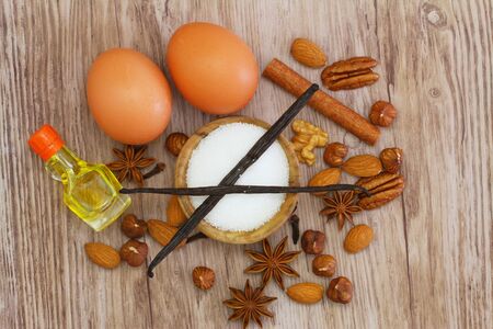 Selection of baking ingredients on wooden surfaceの写真素材