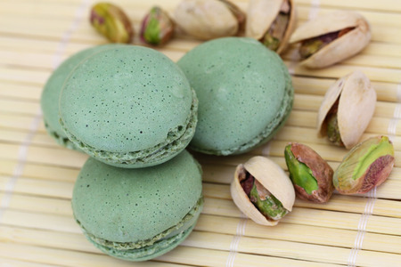 Pistachio macaroons and pistachio nutsの写真素材
