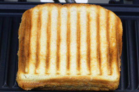 Toasted sandwich in toaster, close upの写真素材