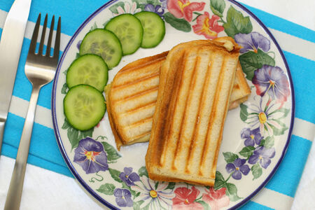 Toasted sandwich with ham and cheese, close upの写真素材