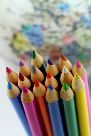 Colorful pencils with globe in the backgroundの写真素材