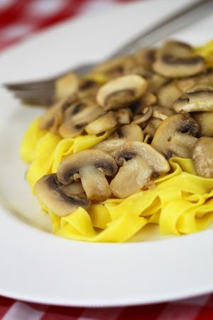 Pasta tagliatelle with mushroomsの写真素材