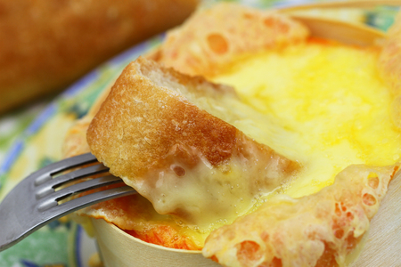 Baked Swiss cheese, close upの写真素材