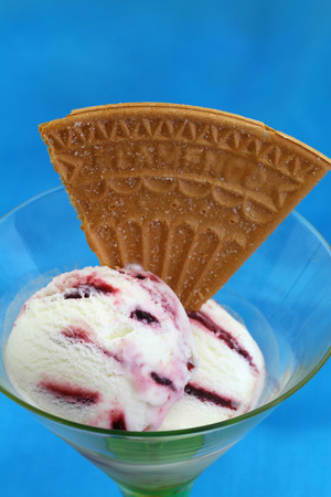 Forest fruit ice cream in sundae glass with waferの写真素材