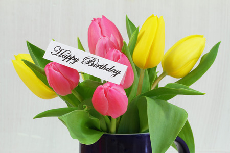 Happy Birthday card with colorful tulipsの写真素材