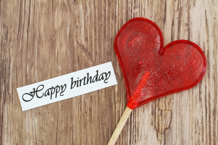 Happy Birthday card with heart shaped lollipopの写真素材
