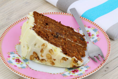 Carrot cake with walnuts and marzipan icing, close upの写真素材