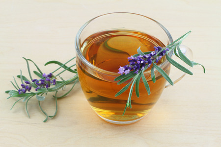 Lavender tea with fresh lavender on wooden surfaceの写真素材