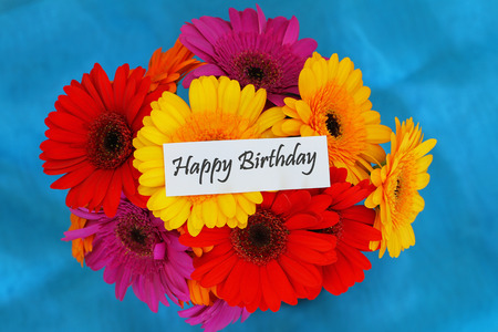 Happy Birthday card with colorful gerbera daisies bouquetの写真素材