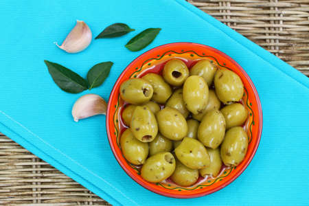 Green olives with garlicの写真素材