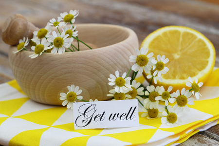Get well card with chamomile flowers and fresh lemonの写真素材