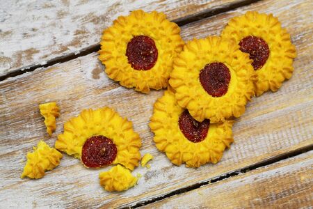 Cookies with jam on rustic wooden surfaceの写真素材