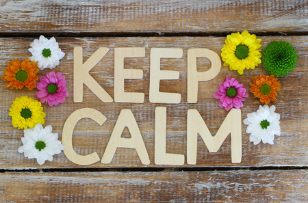 Keep calm written with wooden letters and flowers Santiniの写真素材