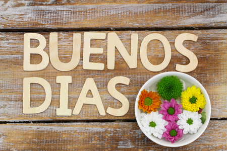 Buenos Dias Good morning in Spanish written with wooden letters and flowers Santiniの写真素材