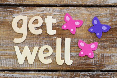 Get well written with wooden letters on rustic wooden surfaceの写真素材