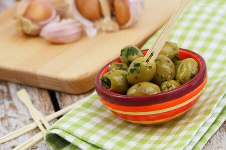 Green olives with garlicの写真素材