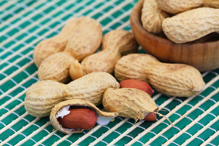Peanuts with and without shell, close up