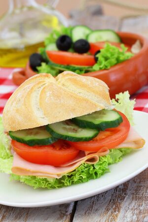 Healthy lunch Consisting of ham roll and green saladの写真素材