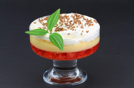 Traditional English trifle dessert on black background with copy spaceの写真素材