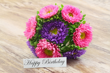 Happy Birthday card with colorful aster flowers bouquetの写真素材