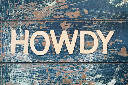 Word howdy written with wooden letters on rustic surfaceの写真素材