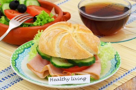 Healthy living card with sandwich and bowl of saladの写真素材