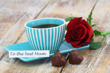 To the best mum card with cup of coffee, chocolate hearts and red roseの写真素材