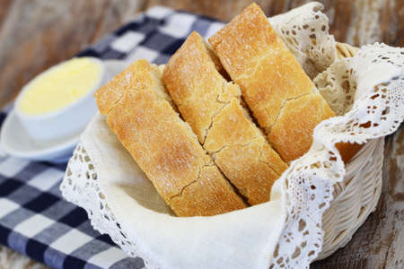 Slices of ciabatta in bread basket, closeupの写真素材