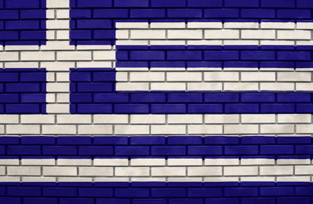 Flag of the Greece on brick wallの写真素材