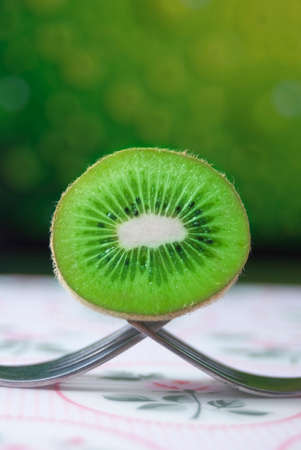 Fresh Kiwi fruit on forksの写真素材