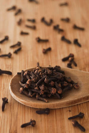 clove spice on wood backgroundの写真素材