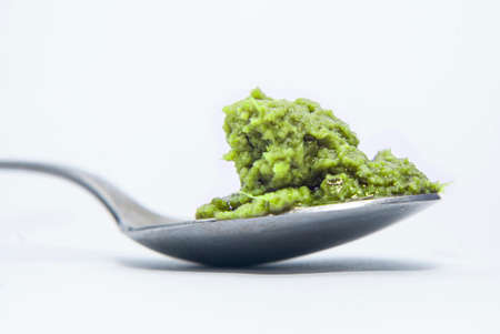 pesto on a spoonの写真素材