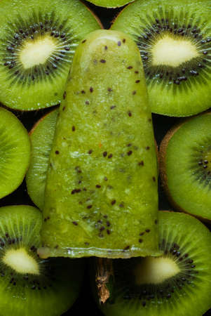 ice lolly with kiwi on a dark backgroundの写真素材