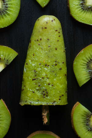 ice lolly with kiwi on a dark backgroundの写真素材