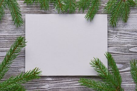 Christmas background of primed cardboard, twigs on the Boardの写真素材