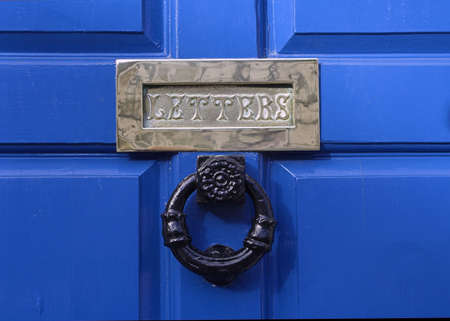 Blue Door and Brass Letterboxの写真素材