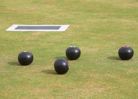 Game of lawn bowls with bowling woodsの写真素材