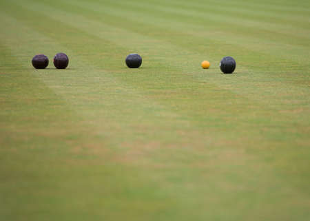 A game of lawn bowls showing woods and the jack.の写真素材