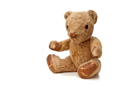 On old worn-out and much loved  teddy bearの写真素材