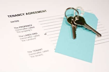 A tenancy agreement form and a set of house keysの写真素材